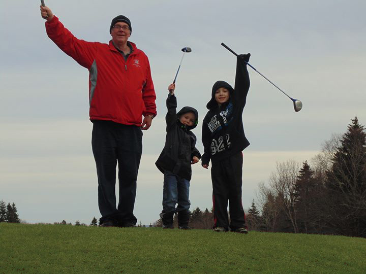 family holding up club clubs